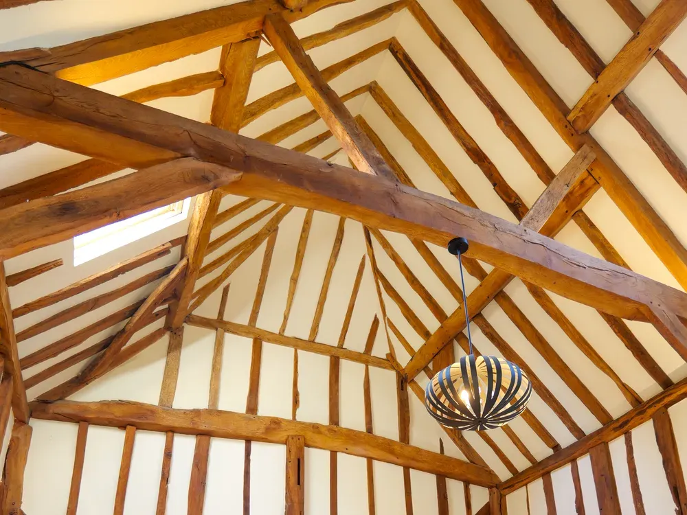 Open-plan interior with vaulted ceiling and exposed timber beams